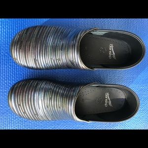Dansko clogs in excellent condition. Multi color
